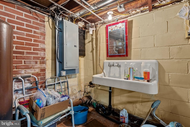 unfinished basement featuring a sink and electric panel