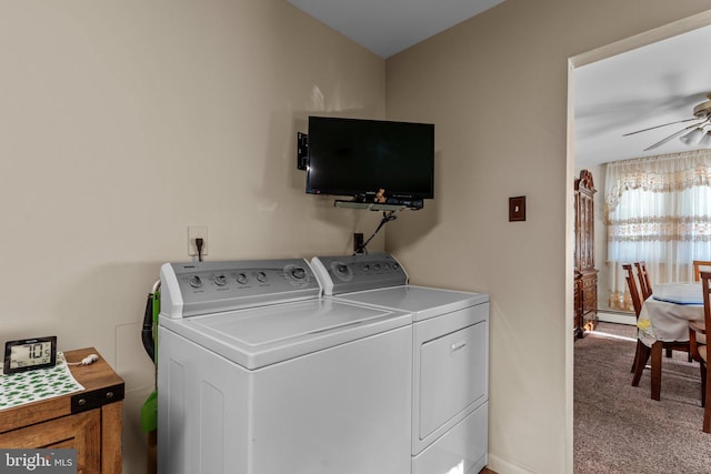 laundry area with a ceiling fan, carpet floors, laundry area, a baseboard heating unit, and independent washer and dryer