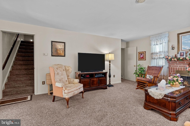 living area with a fireplace, stairs, baseboards, and carpet floors