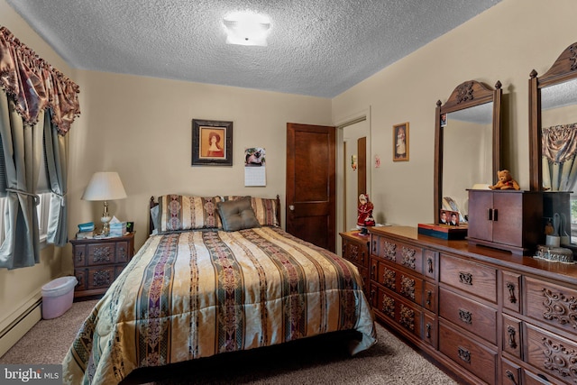 carpeted bedroom with baseboard heating and a textured ceiling