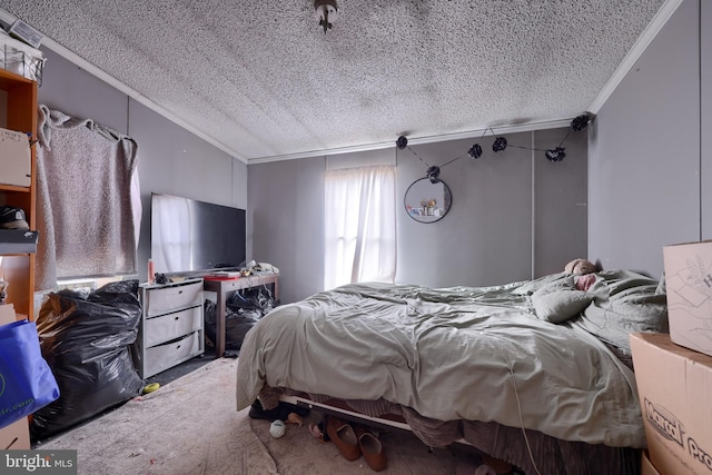 bedroom with crown molding, carpet, and a textured ceiling