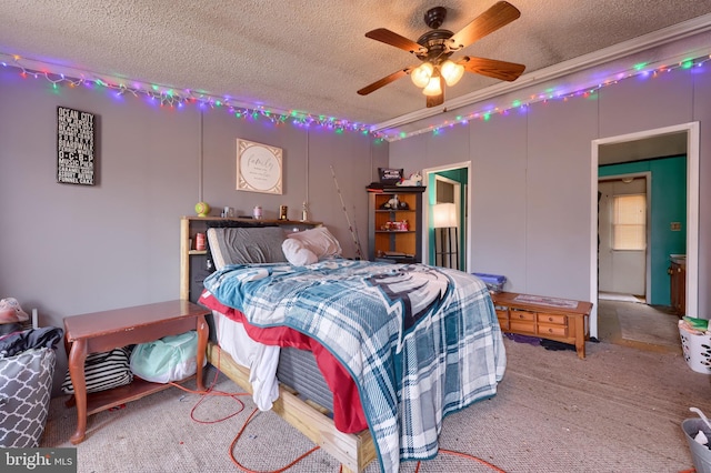 bedroom featuring a textured ceiling and a ceiling fan