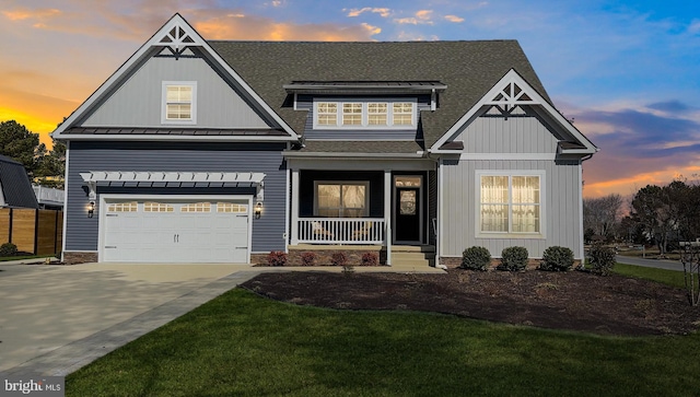 view of front of home with driveway, a standing seam roof, a porch, an attached garage, and a shingled roof