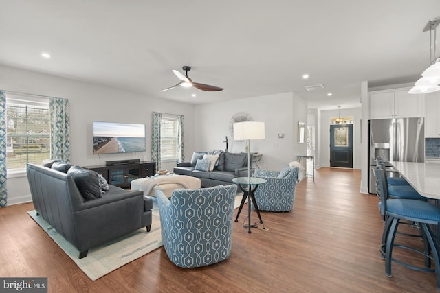 living area featuring dark wood-style floors, visible vents, recessed lighting, and ceiling fan