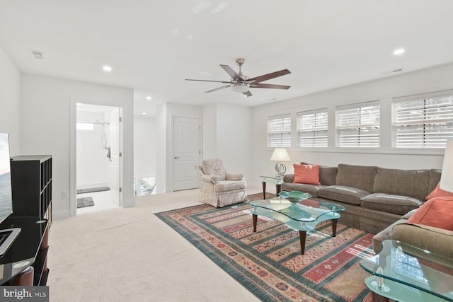 carpeted living room featuring recessed lighting, visible vents, and ceiling fan