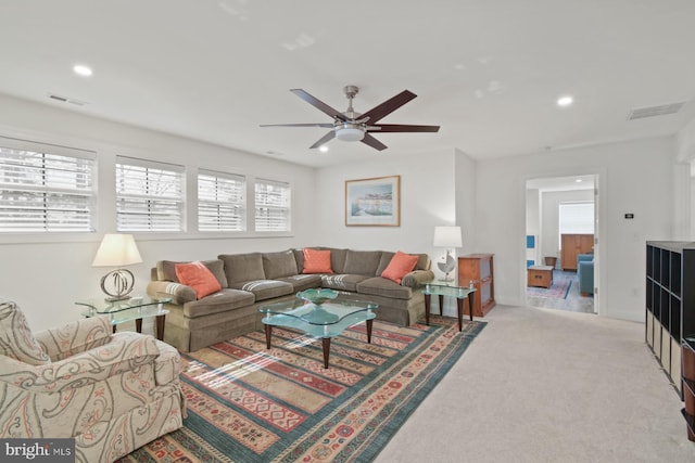 carpeted living room with recessed lighting, visible vents, and a healthy amount of sunlight