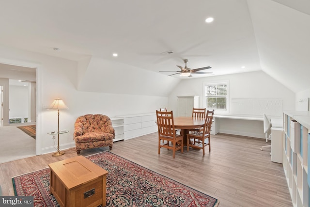 interior space featuring recessed lighting, light wood-type flooring, lofted ceiling, and visible vents