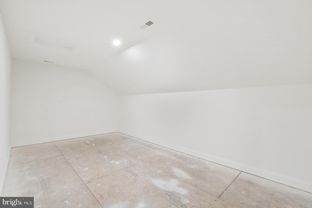 bonus room with visible vents, baseboards, and lofted ceiling