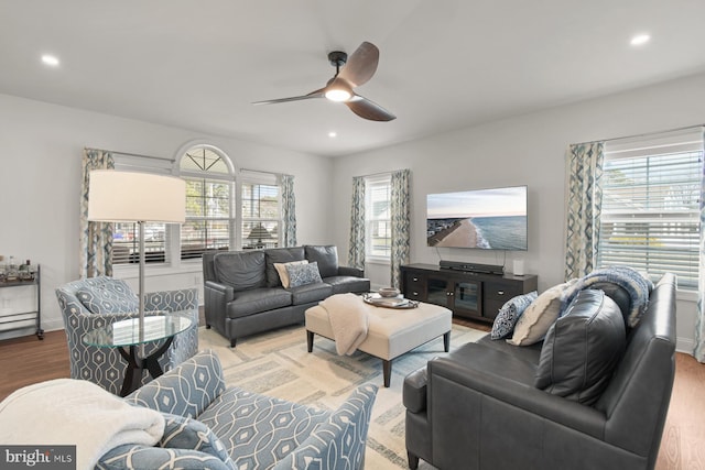 living area with recessed lighting, plenty of natural light, ceiling fan, and light wood finished floors