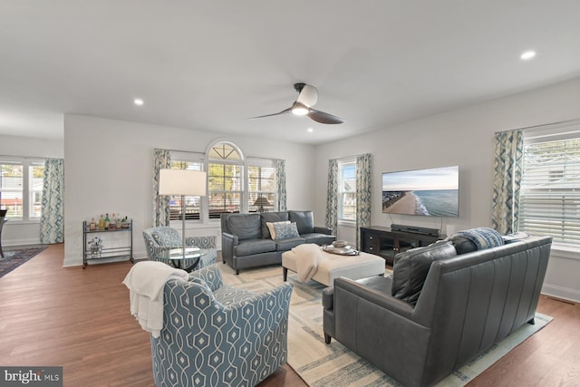 living room with recessed lighting, ceiling fan, baseboards, and wood finished floors