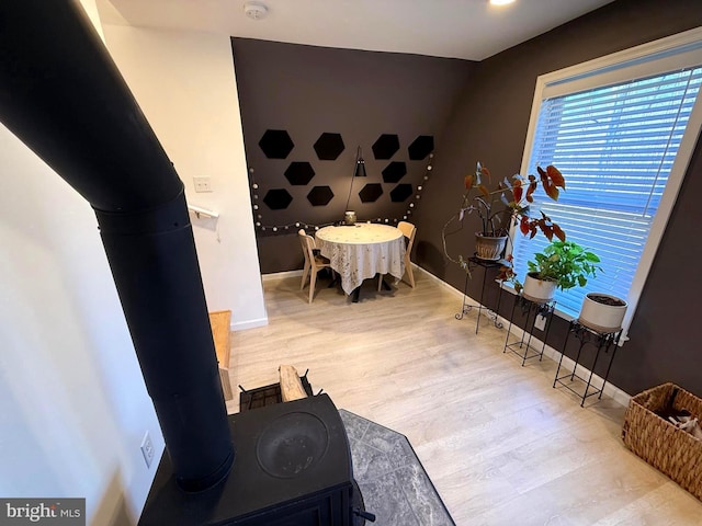 dining area featuring wood finished floors and baseboards