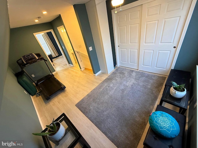 workout area featuring wood finished floors