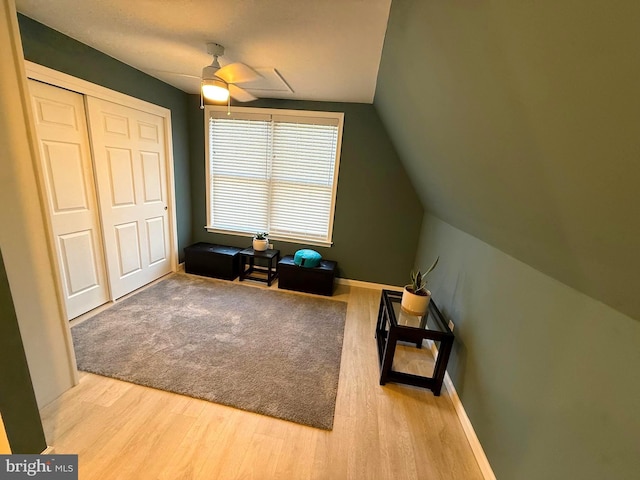 additional living space featuring a ceiling fan, vaulted ceiling, wood finished floors, and baseboards