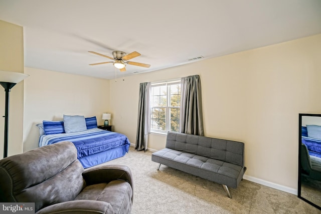 bedroom featuring visible vents, carpet floors, baseboards, and a ceiling fan