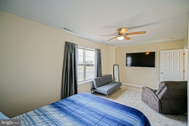 carpeted bedroom featuring visible vents, ceiling fan, and baseboards