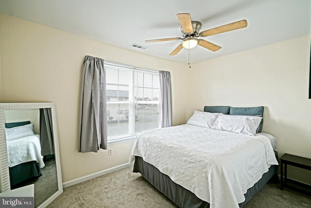 bedroom featuring visible vents, carpet flooring, baseboards, and ceiling fan