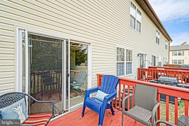 wooden terrace featuring grilling area