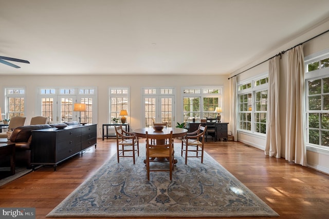 dining area featuring ceiling fan and wood finished floors