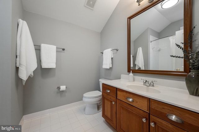 bathroom with tile patterned floors, visible vents, toilet, vanity, and vaulted ceiling