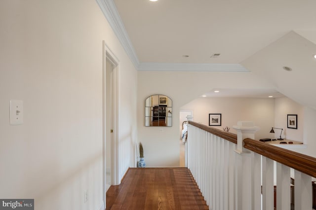 hall with an upstairs landing, recessed lighting, and crown molding