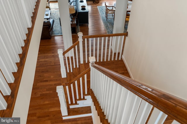 stairs with wood finished floors