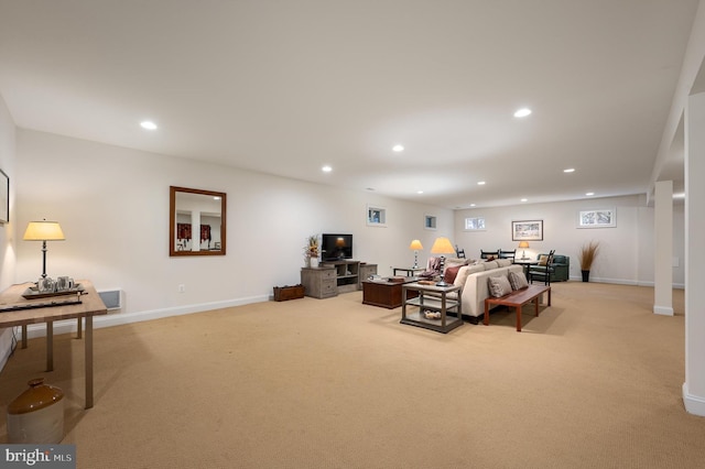 living area with recessed lighting, light colored carpet, and baseboards