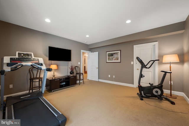 exercise area with recessed lighting, carpet, and baseboards