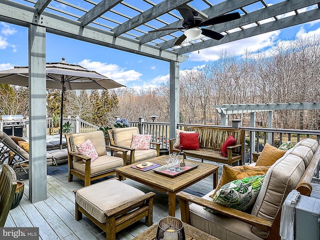 wooden terrace featuring an outdoor living space, a grill, a pergola, and a ceiling fan