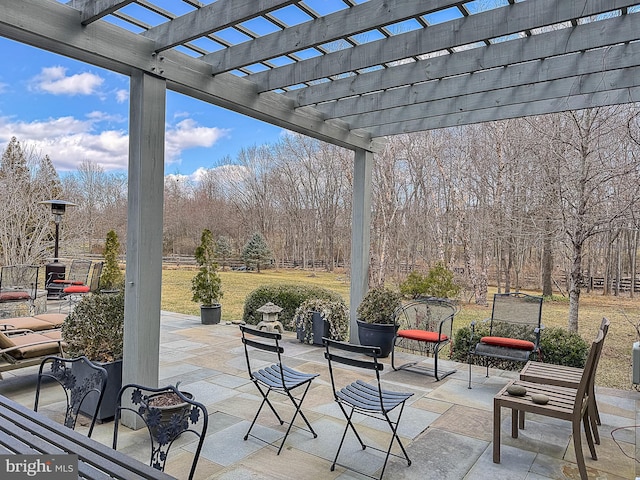 view of patio / terrace featuring fence and a pergola