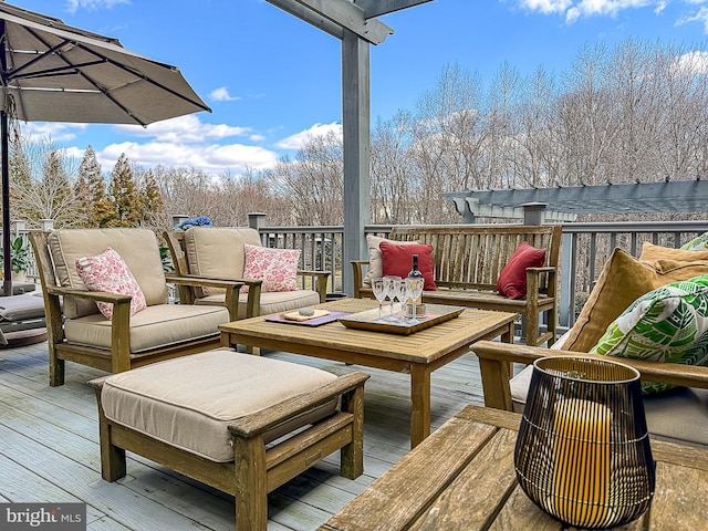 wooden terrace with an outdoor hangout area