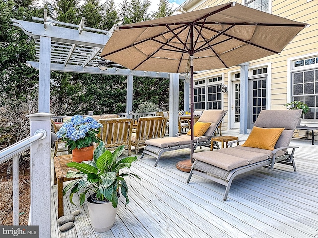 wooden deck featuring a pergola