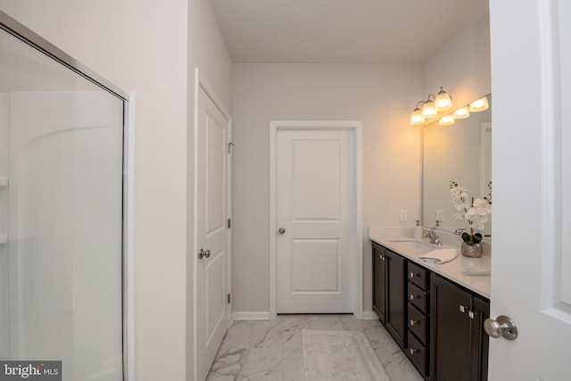 bathroom featuring an enclosed shower, marble finish floor, a sink, double vanity, and baseboards