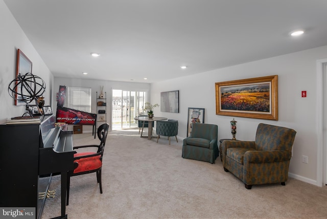 living area featuring recessed lighting, baseboards, and carpet floors