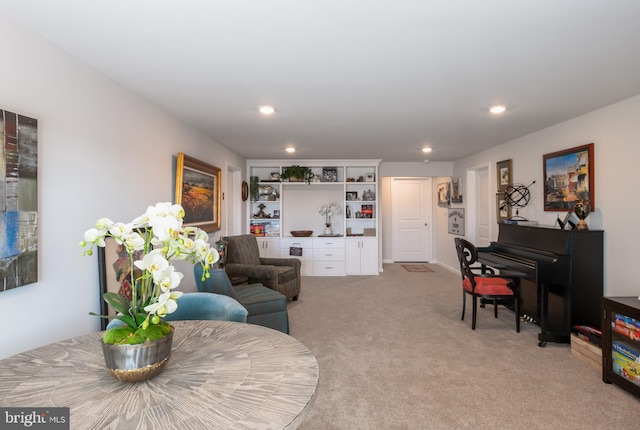 living room featuring recessed lighting and light carpet