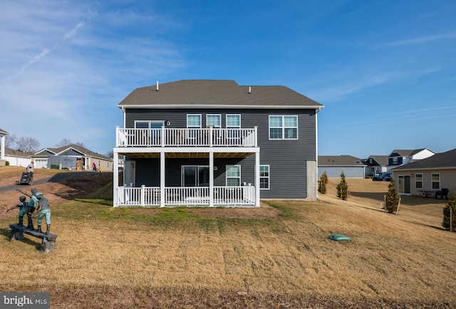 back of property featuring a lawn