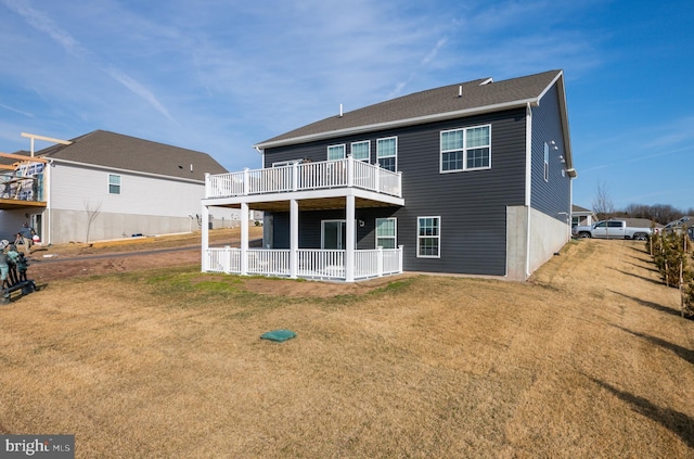 back of house featuring a yard