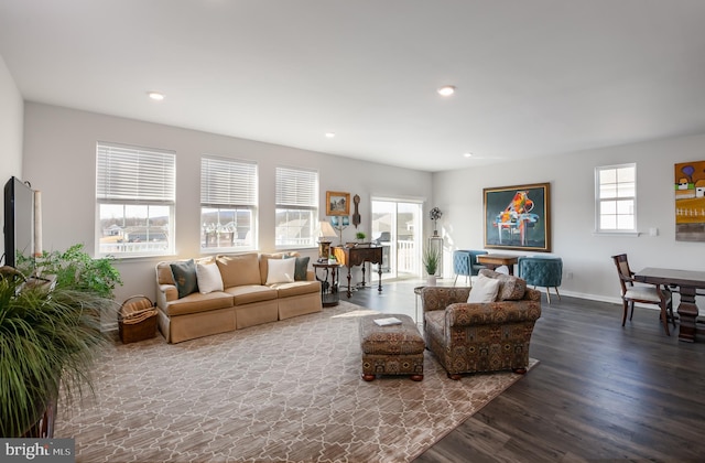 living room featuring recessed lighting, wood finished floors, and baseboards