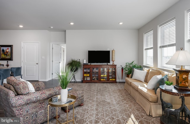 living room featuring recessed lighting and baseboards