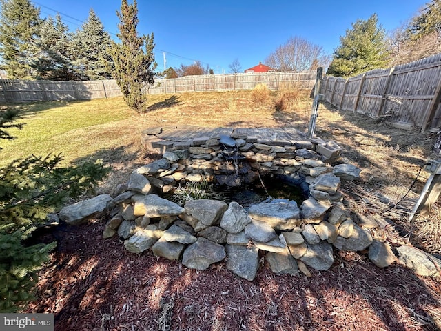 view of yard with a fenced backyard