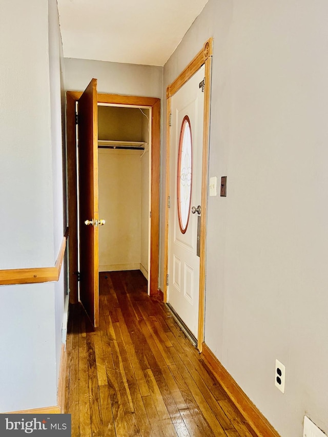 corridor featuring hardwood / wood-style floors