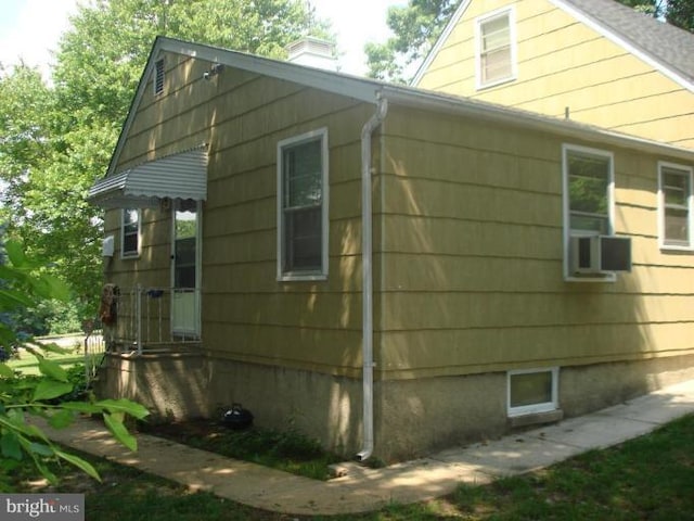 view of side of property with a chimney