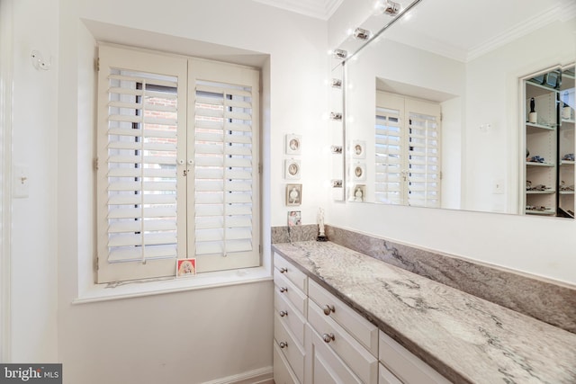 bathroom featuring vanity and crown molding