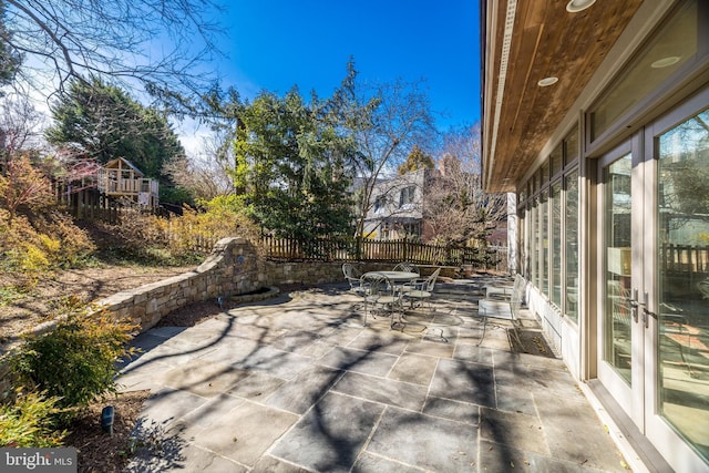 view of patio / terrace featuring outdoor dining space and fence