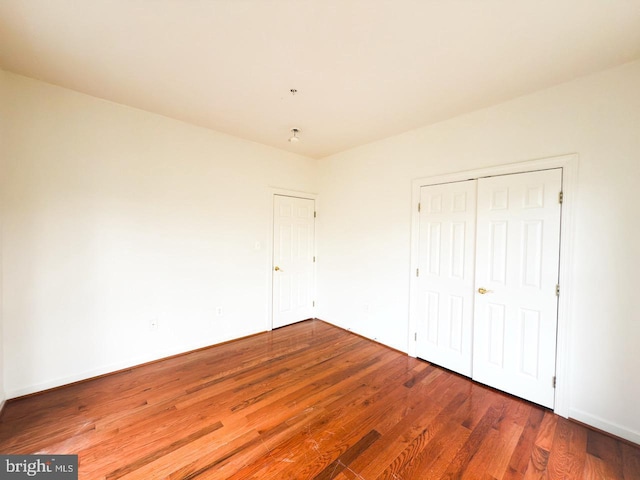 unfurnished bedroom with wood finished floors
