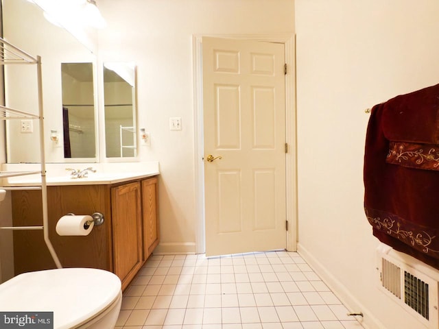 bathroom with tile patterned flooring, visible vents, toilet, vanity, and baseboards