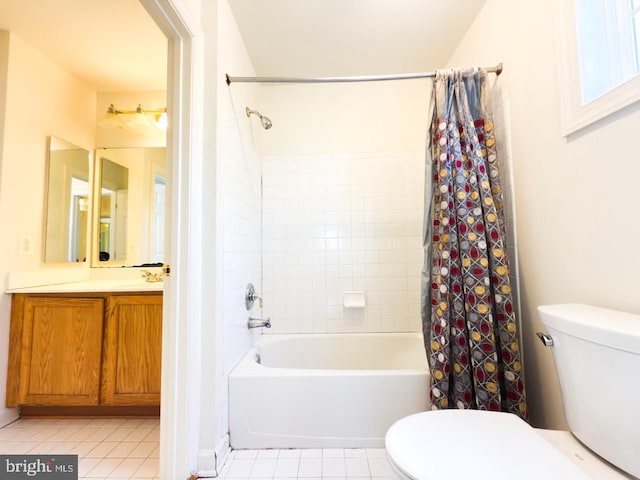 full bath with tile patterned flooring, shower / bathtub combination with curtain, and toilet