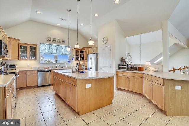 kitchen with visible vents, a center island with sink, light countertops, light tile patterned floors, and appliances with stainless steel finishes