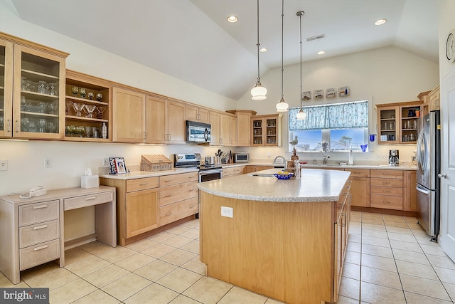 kitchen featuring light countertops, visible vents, appliances with stainless steel finishes, and light brown cabinetry