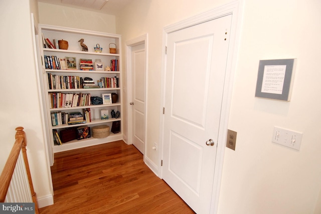 hallway featuring wood finished floors