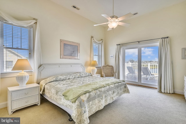 bedroom with access to exterior, baseboards, visible vents, and light carpet